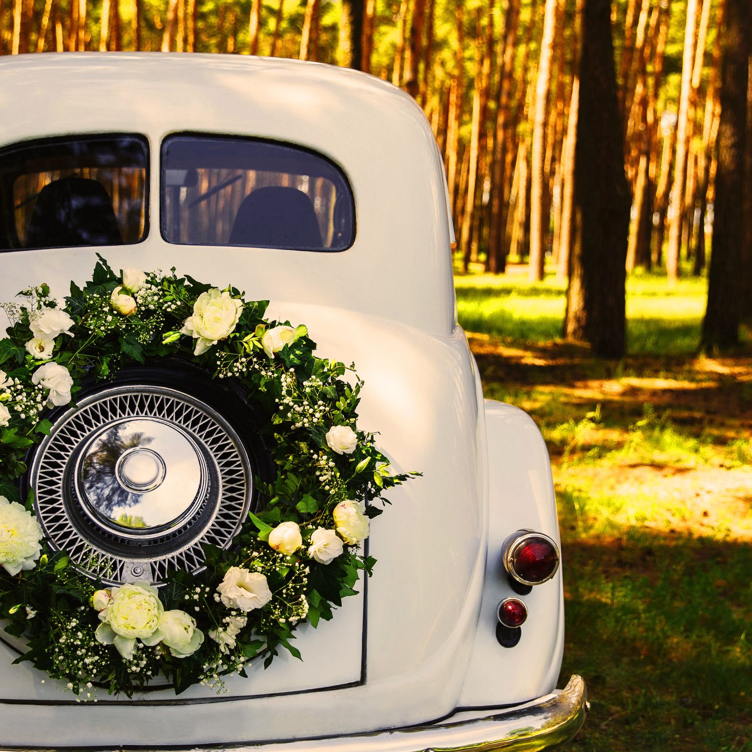 Affordable website audit - represented by a white car with a floral wreath on its boot